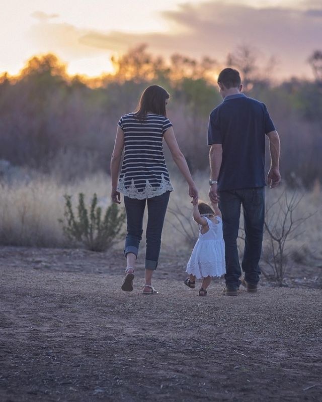 A family walking together at dusk