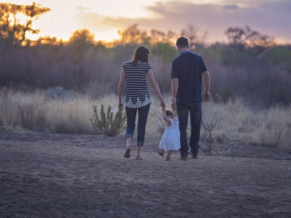 A family walking together at sunset