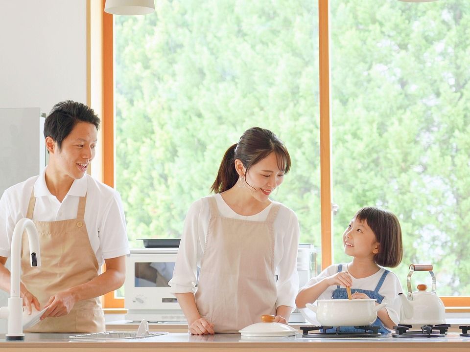 A family making breakfast together